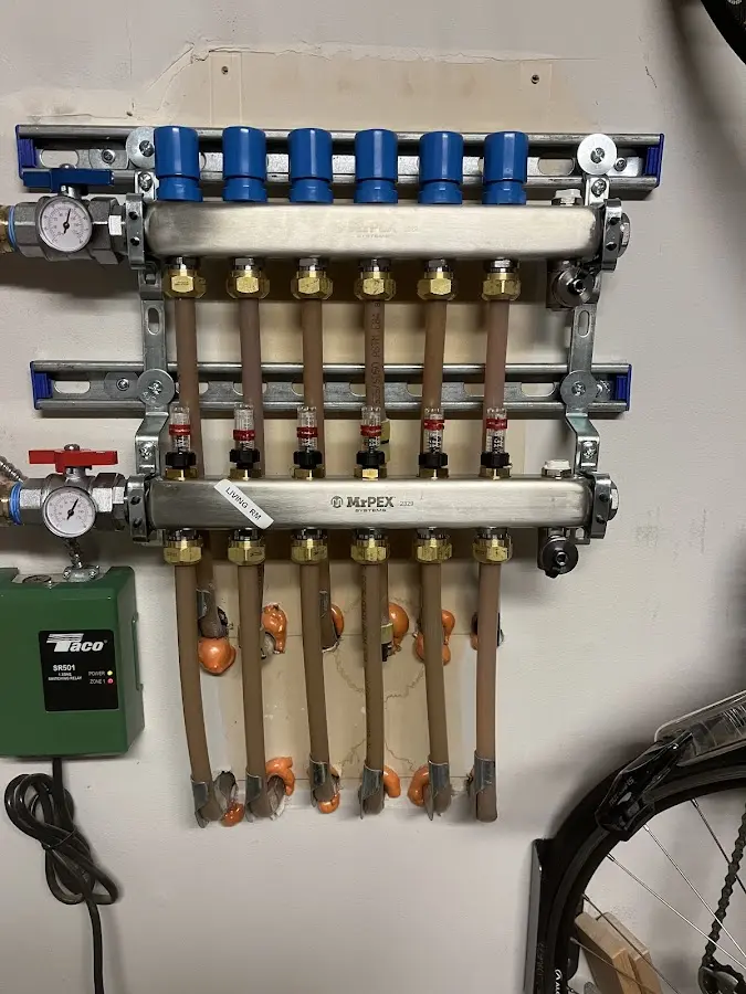 Plumber performing Water Heater Repair at a residential property in Chelmsford